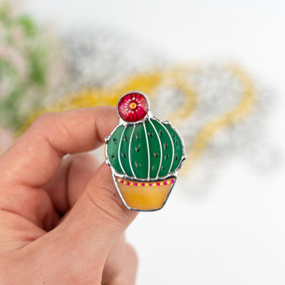 Zoomed stained glass cactus in a pod pin