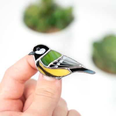 Yellow and green chickadee looking left pin of stained glass