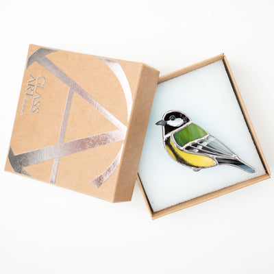 Stained glass yellow and green chickadee pin in a brand box