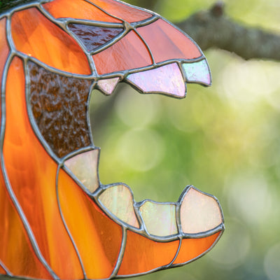 Zoomed stained glass fangs of the pumpkin suncatcher