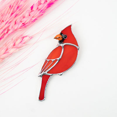 Zoomed stained glass cardinal looking left pin