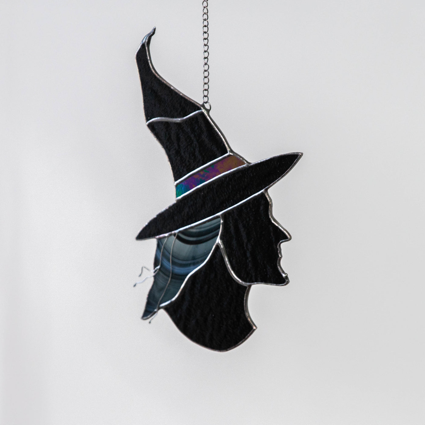 Stained glass portrait of witch in hat window hanging for Halloween