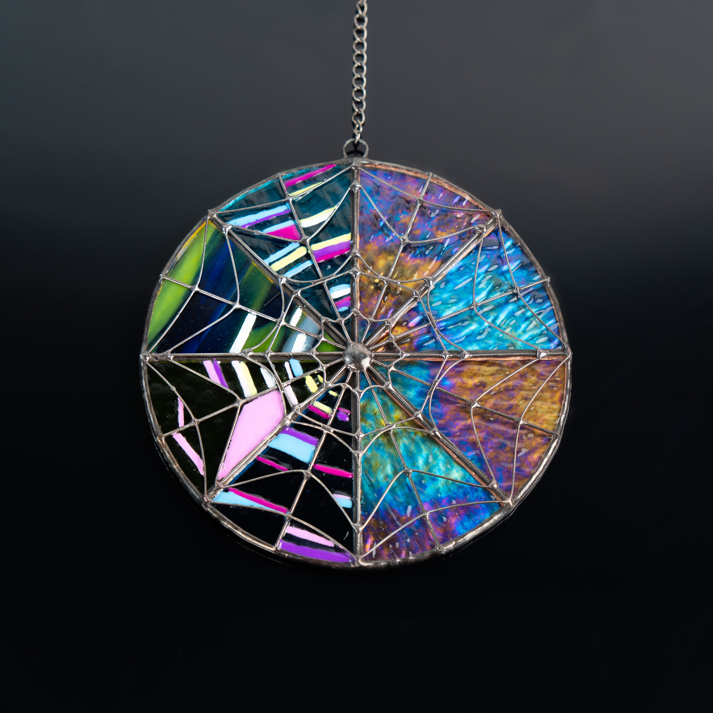 Iridescent stained glass window hanging inspired by the series Wednesday