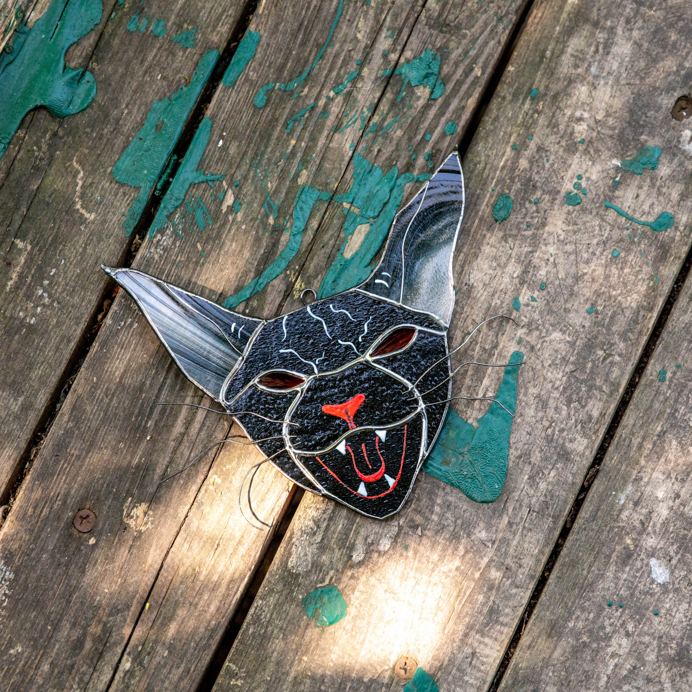 Stained glass cat with red eyes window hanging for Halloween decor