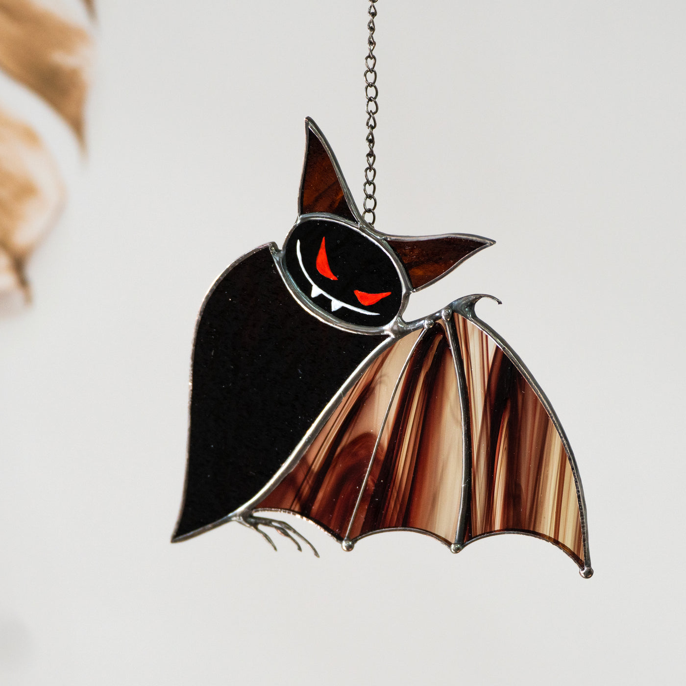 Stained glass brown bat with baroque wings and red eyes suncatcher 