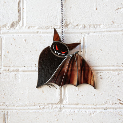Stained glass brown bat with red eyes suncatcher