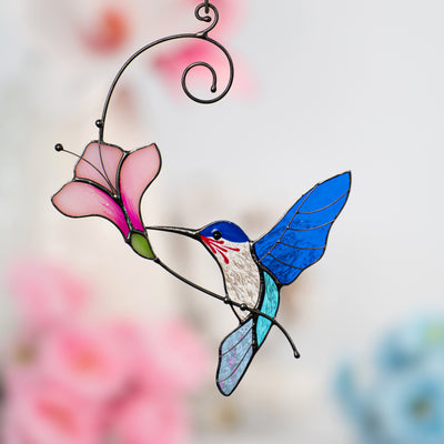 Stained glass green hummingbird with pink flower suncatcher