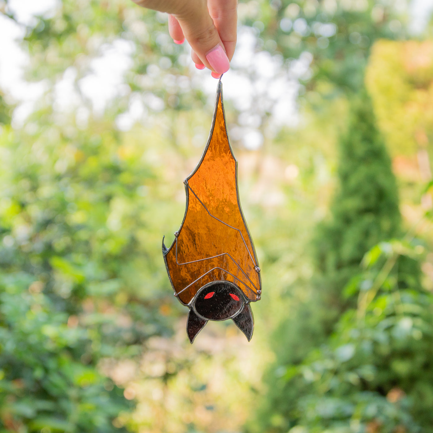 Stained glass Halloween brown bat with red eyes window hanging 
