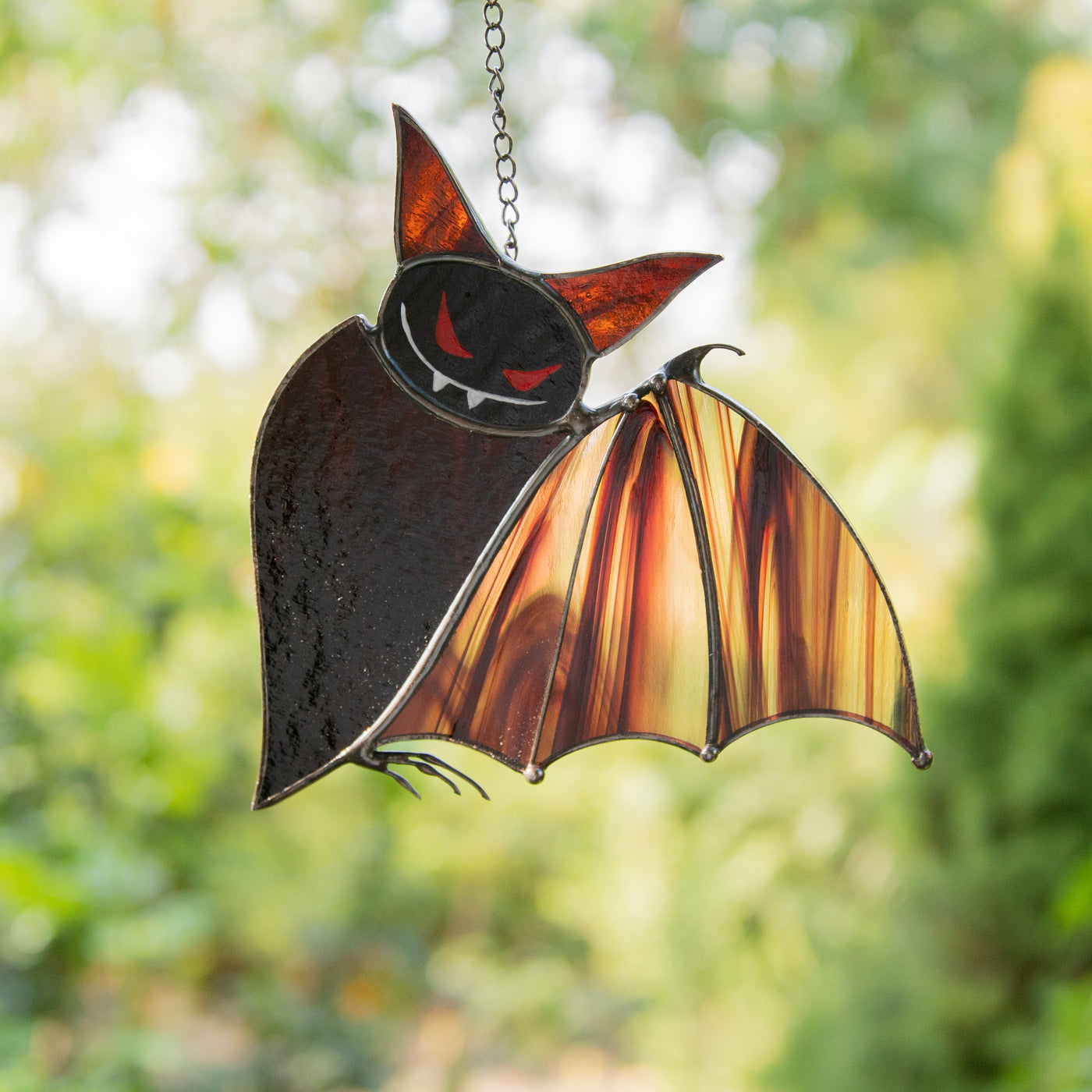 Brown stained glass bat with red eyes suncatcher