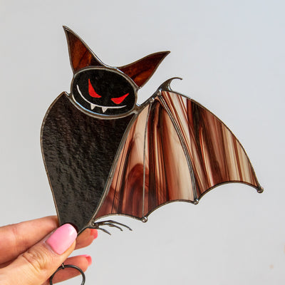 Brown stained glass bat with red eyes suncatcher for Halloween decor