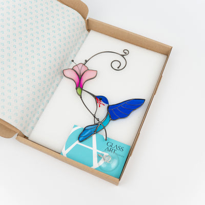 Stained glass blue hummingbird suncatcher in a brand box