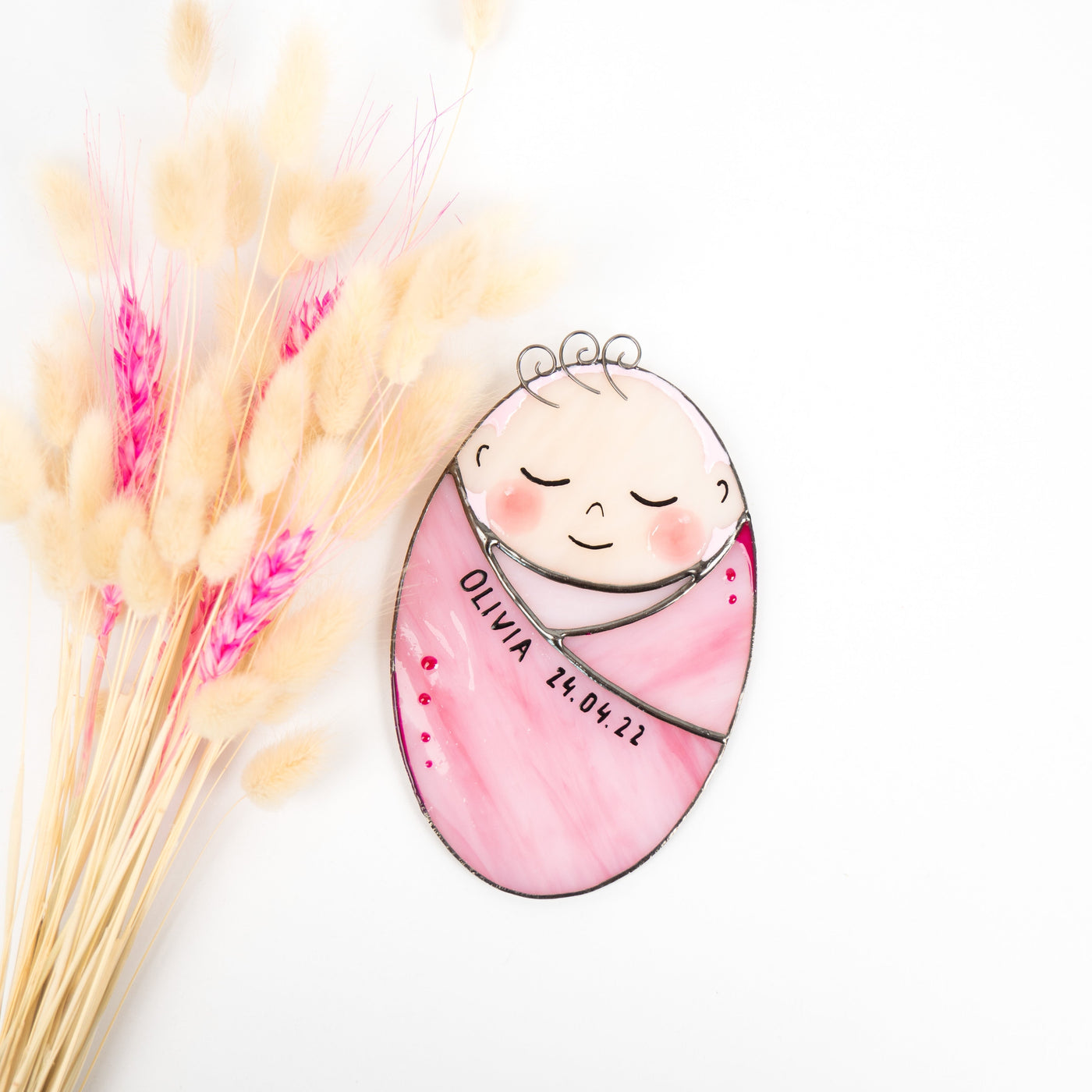 Stained glass baby girl in a pink receiving blanket with the name and birthdate on it suncatcher