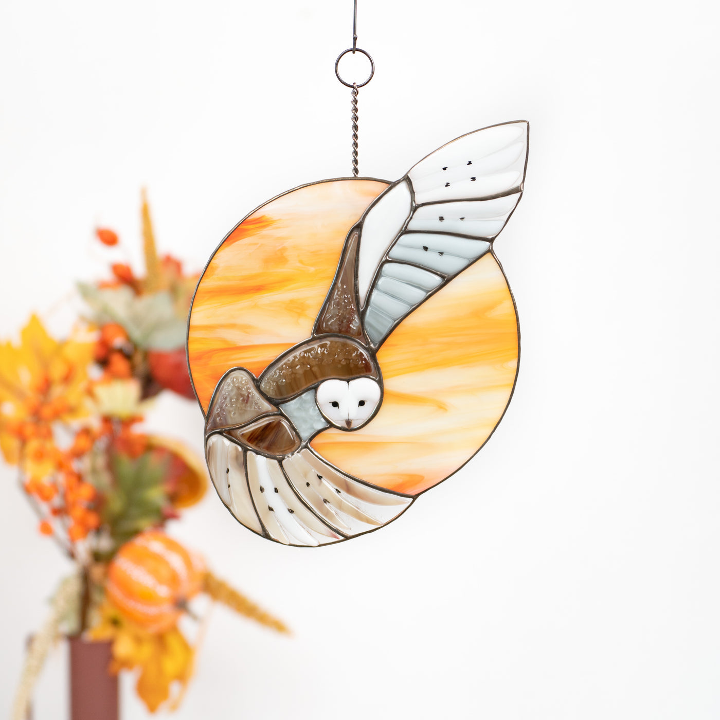 Fused barn owl on orange round background window panel of stained glass