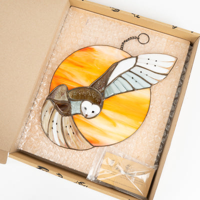 Stained glass barn owl window hanging in a brand box