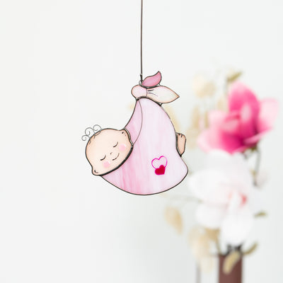 Stained glass baby girl in a pink receiving blanket suncatcher