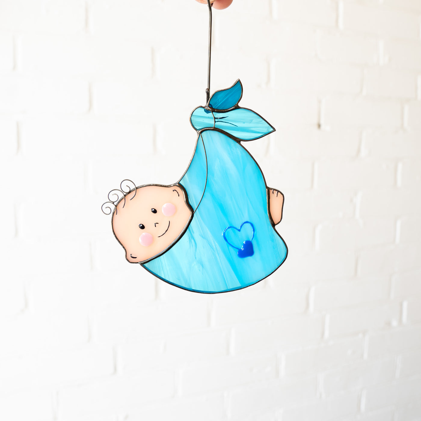 Stained glass suncatcher of a baby boy 