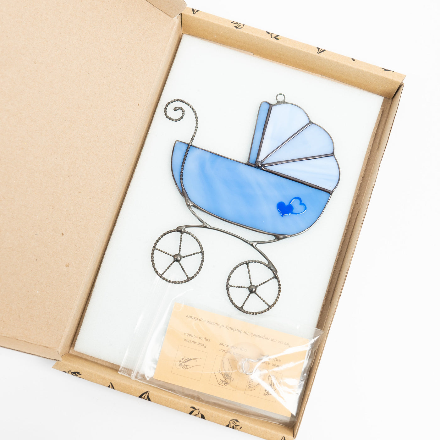 Stained glass blue baby stroller suncatcher in a brand box