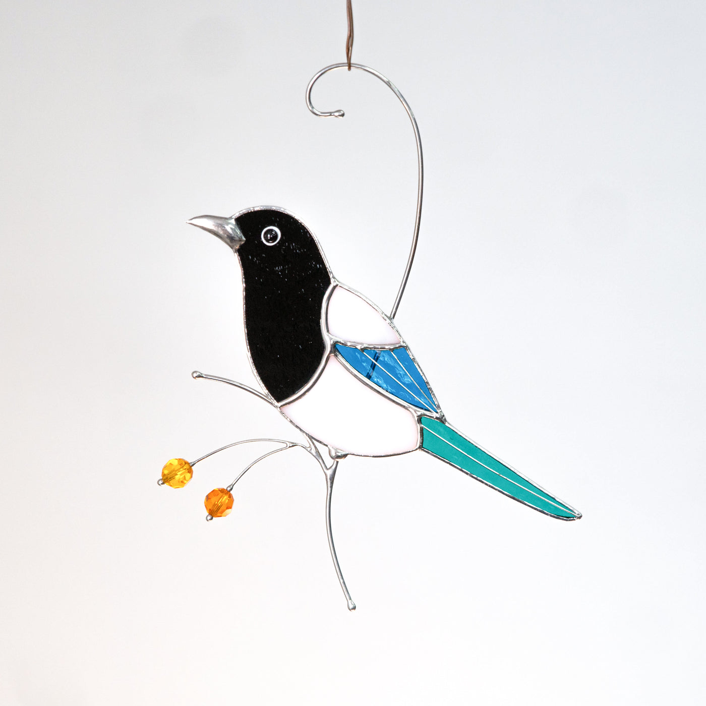Side view magpie looking left suncatcher of stained glass