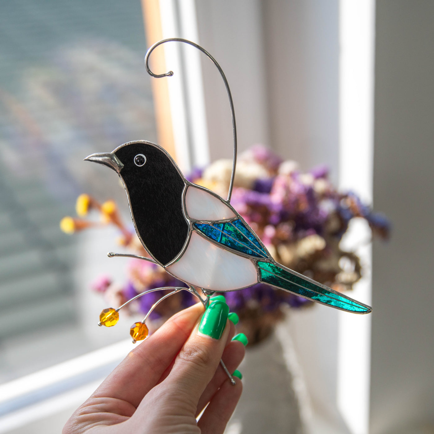 Stained glass side view suncatcher of magpie looking left 