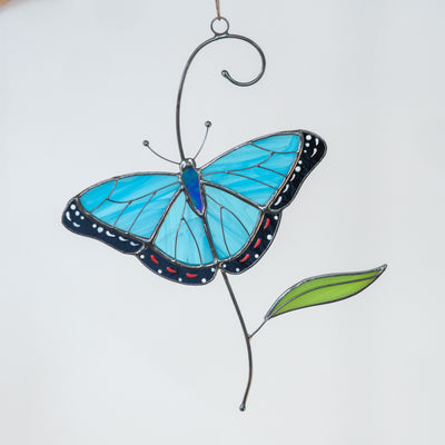 Stained glass morpho butterfly on the branch window hanging