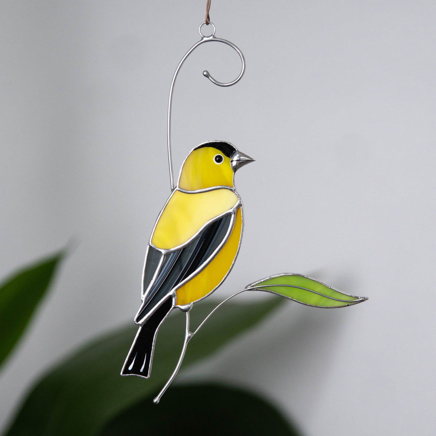 Stained glass looking right goldfinch window hanging