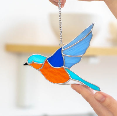 Stained glass flying bluebird window hanging 
