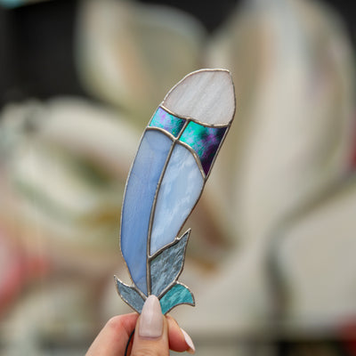 Stained glass window hanging of bluejay feather