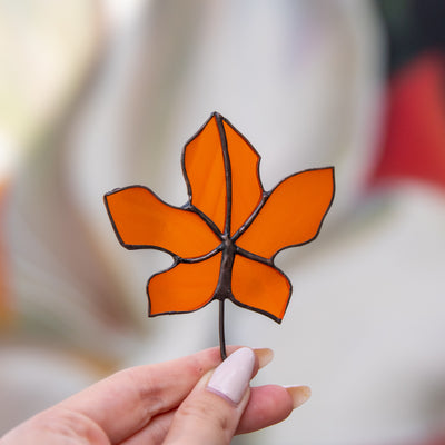 Orange stained glass maple leaf suncatcher