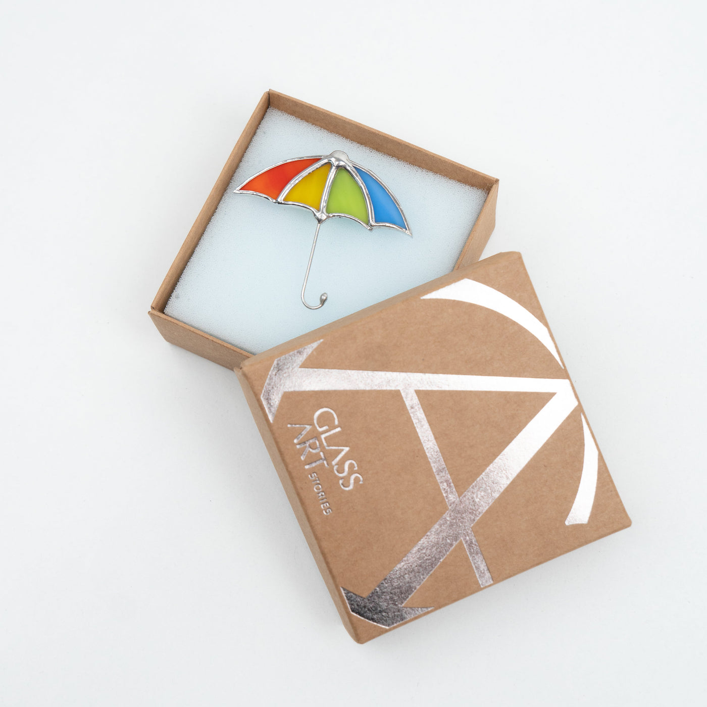Multicolor umbrella pin in a brand box