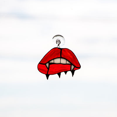 Stained glass suncatcher of vampire lips and teeth
