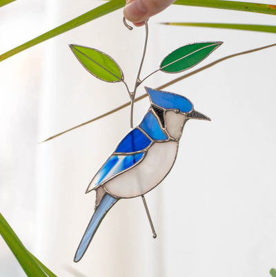 Blue jay on the branch with leaves window hanging of stained glass
