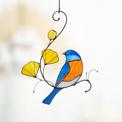 Stained glass bluebird with yellow flowers suncatcher