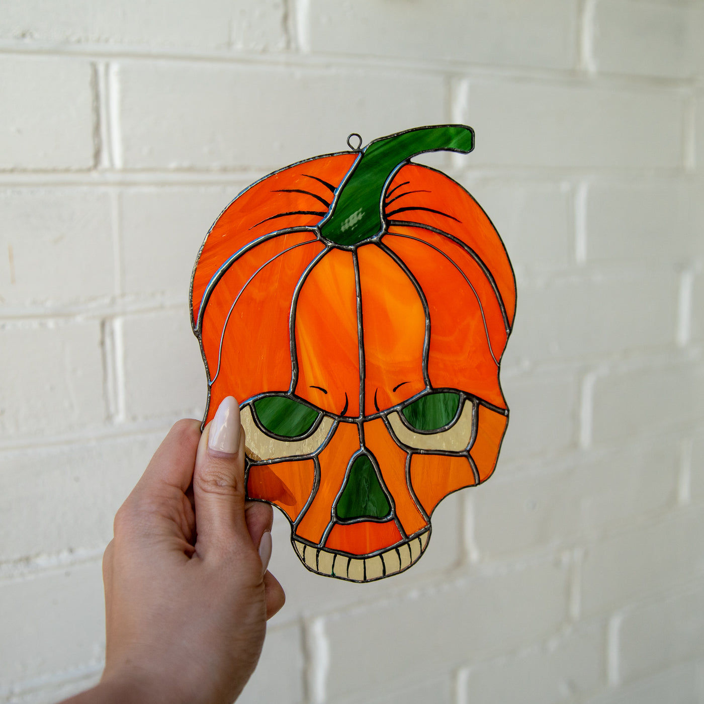 Halloween pumpkin skull suncatcher of stained glass
