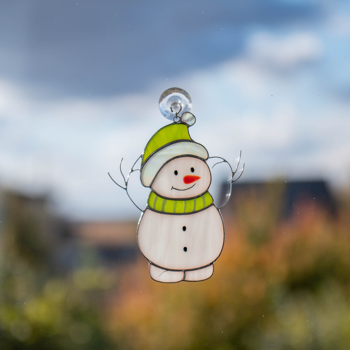 Snowman in green hat suncatcher of stained glass for Christmas