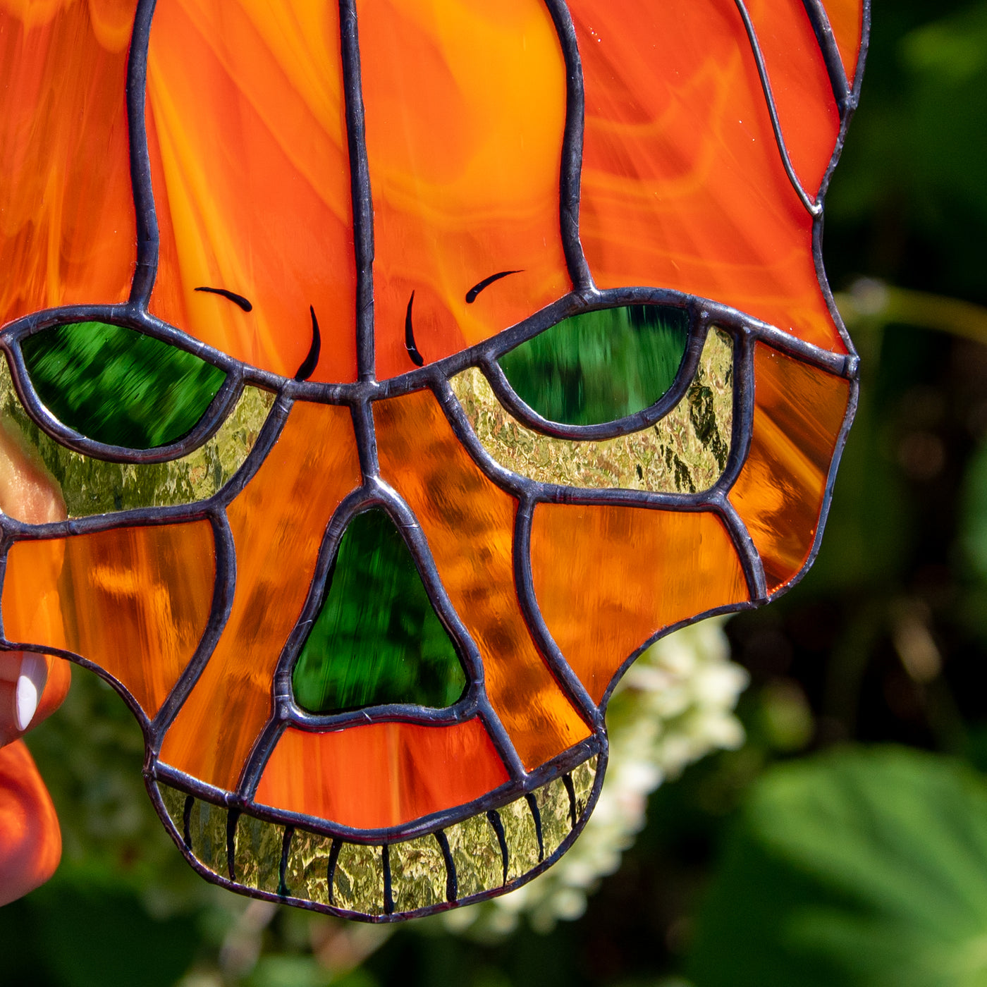 Zoomed stained glass pumpkin skull suncatcher for halloween 