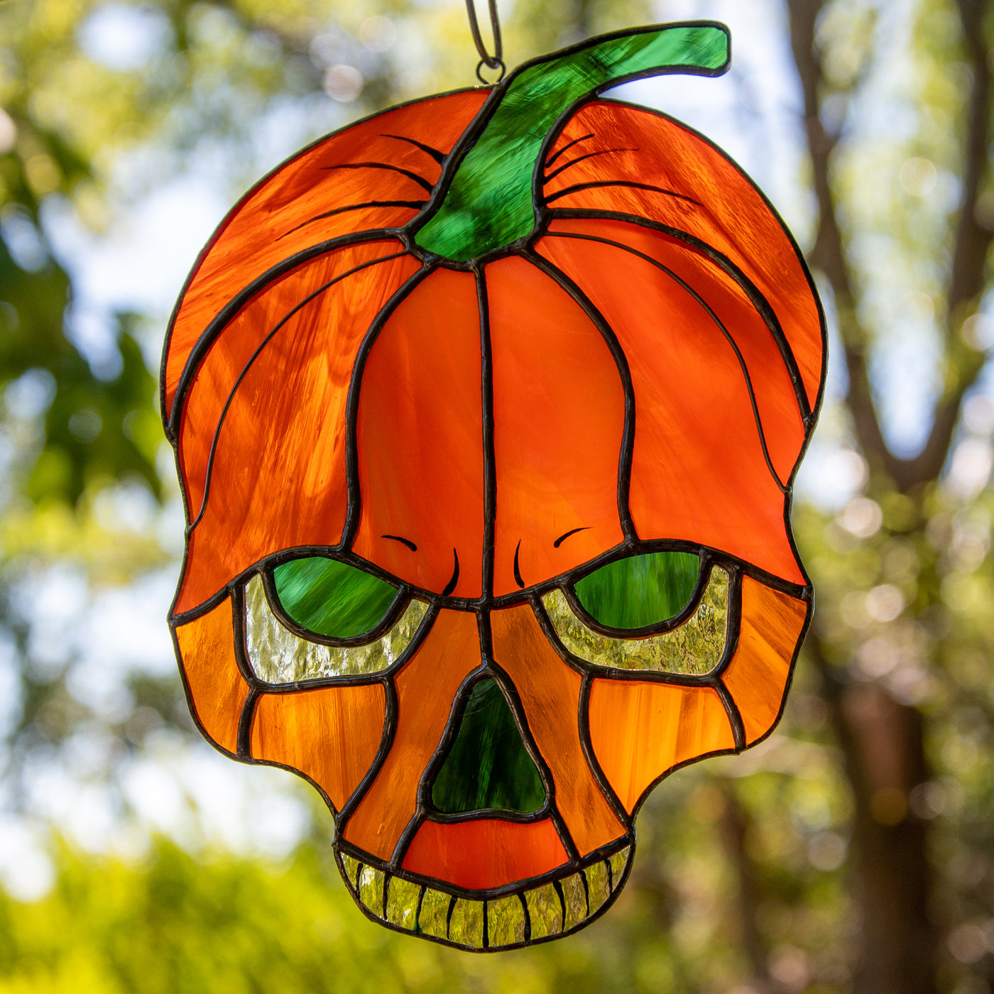 Zoomed stained glass horror pumpkin skull window hanging