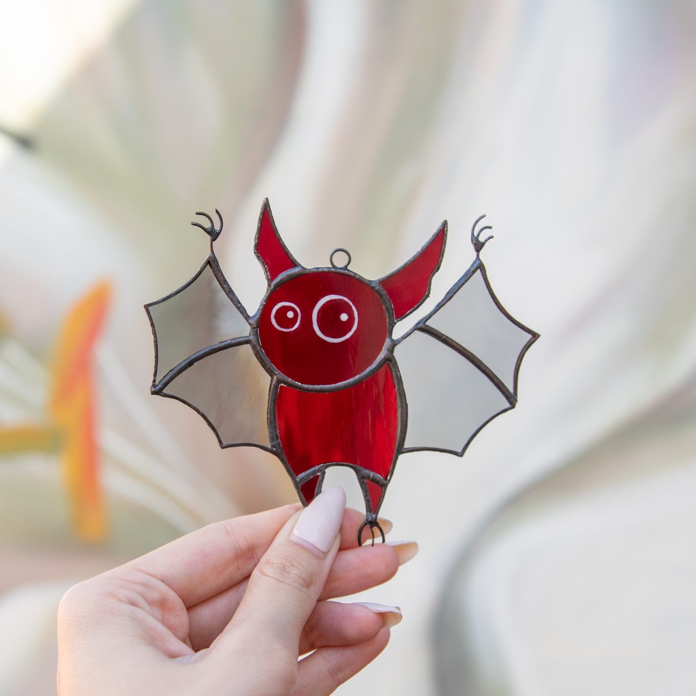 Stained glass Halloween suncatcher of red little bat 