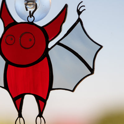 Zoomed stained glass Halloween red bat window hanging