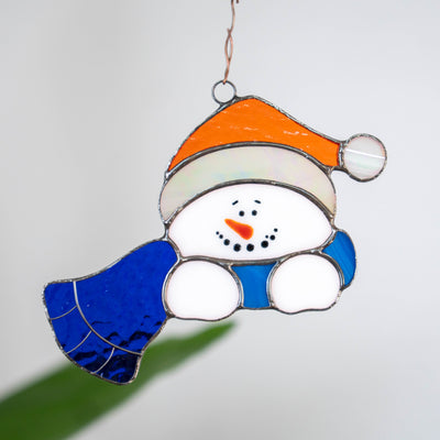Christmas snowman in blue scarf window hanging of stained glass