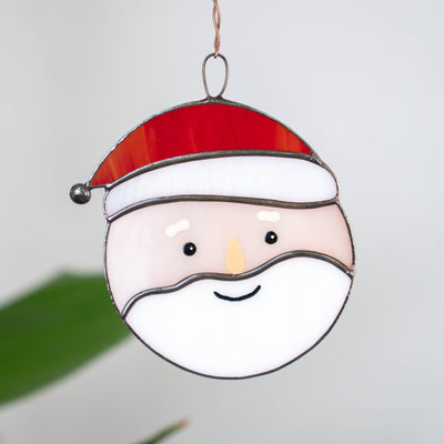 Santa Claus in red hat suncatcher of stained glass