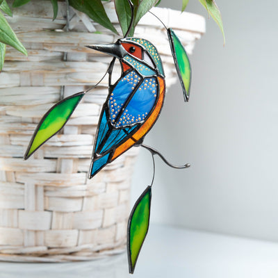 Stained glass kingfisher with leaves window hanging