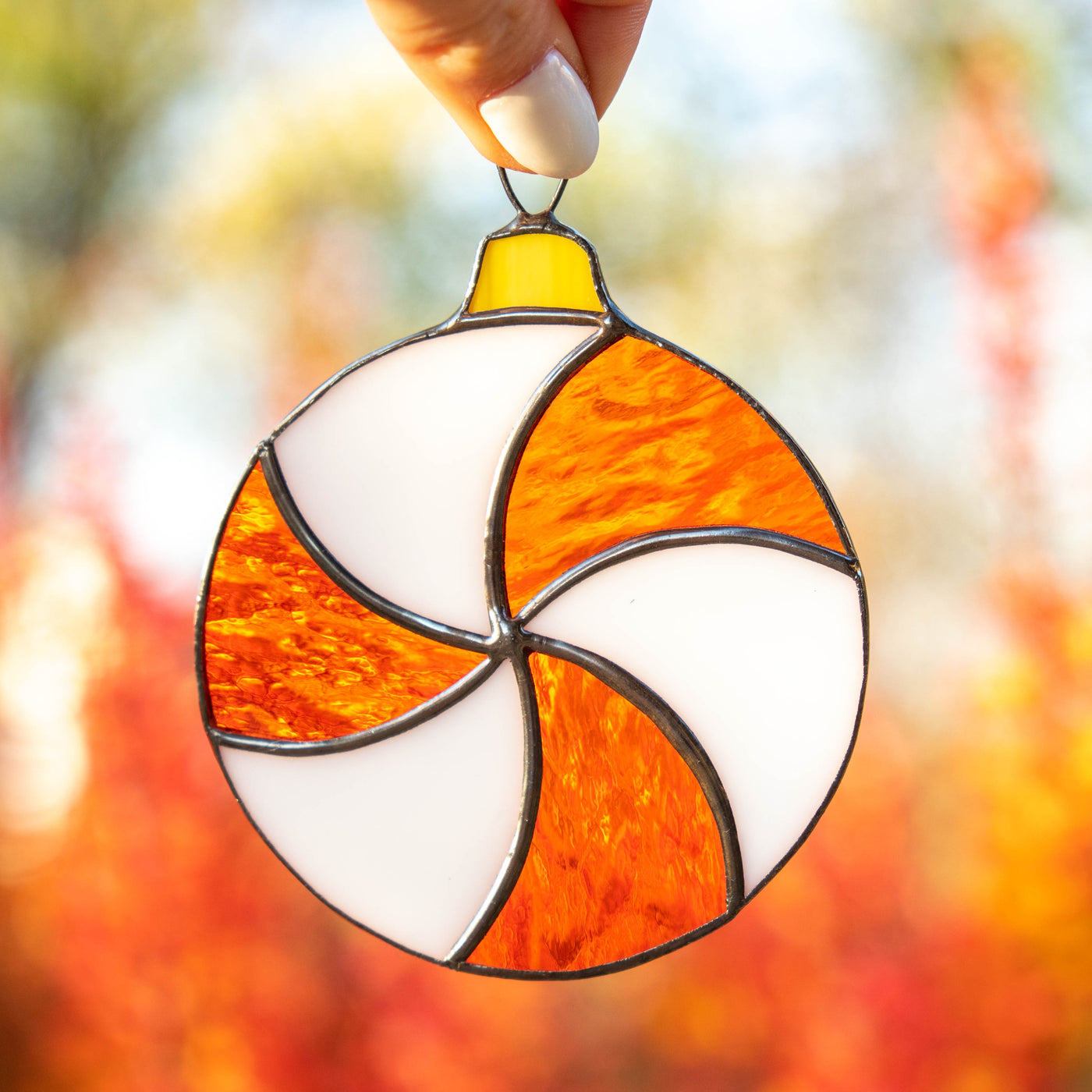 Stained glass round white and orange candy suncatcher 