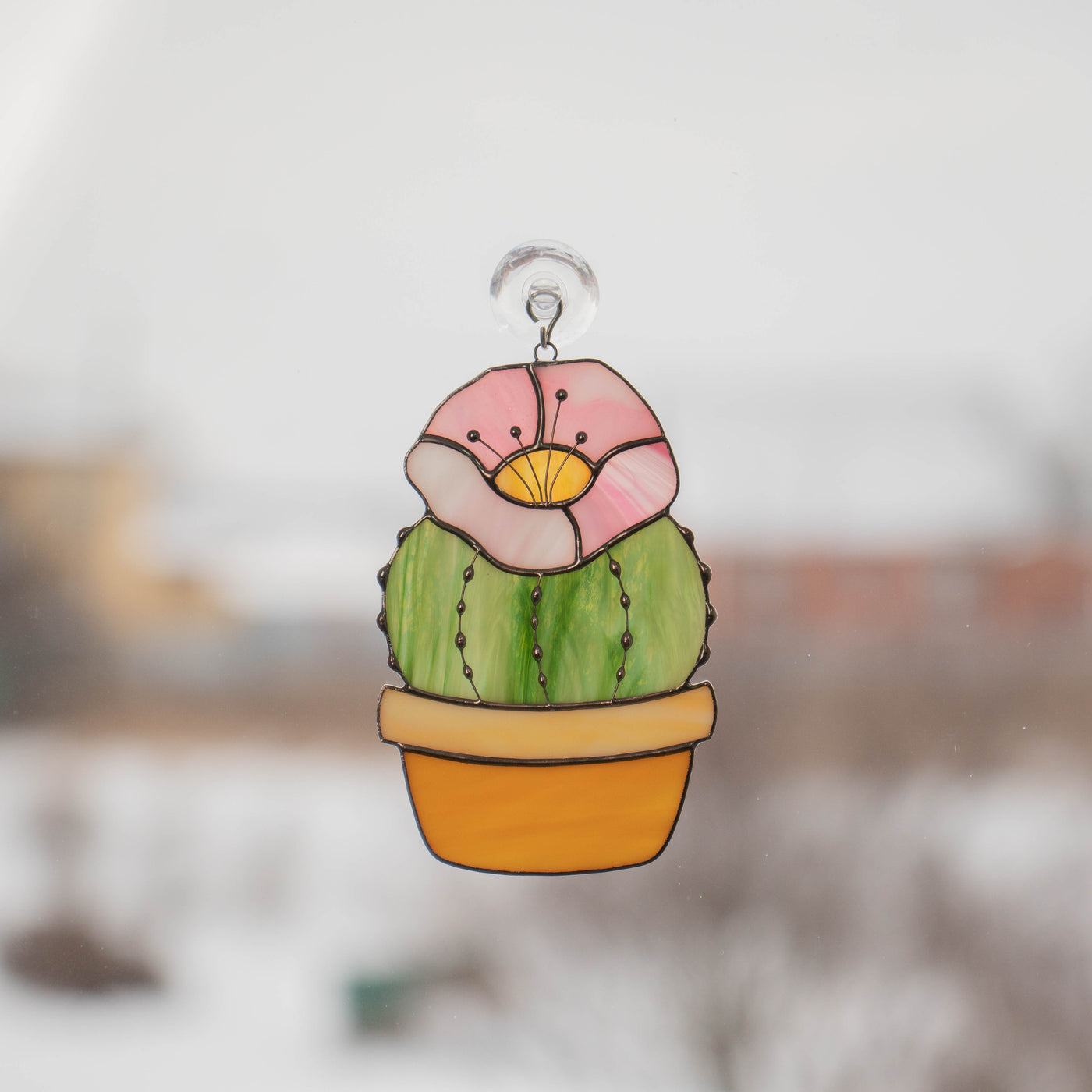 Cactus with pink flower on top suncatcher of stained glass