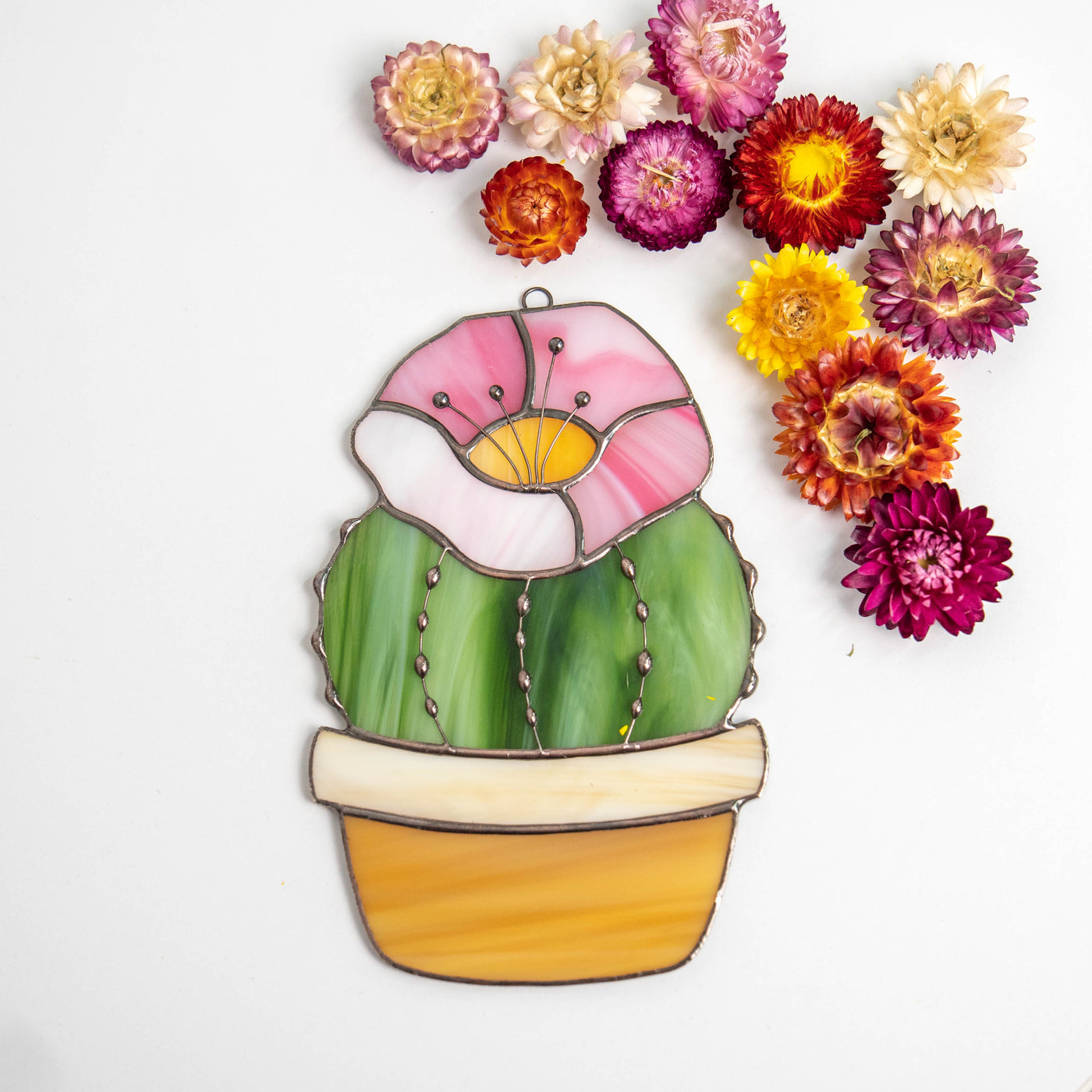 Cactus stained glass suncatcher with pink flower on top