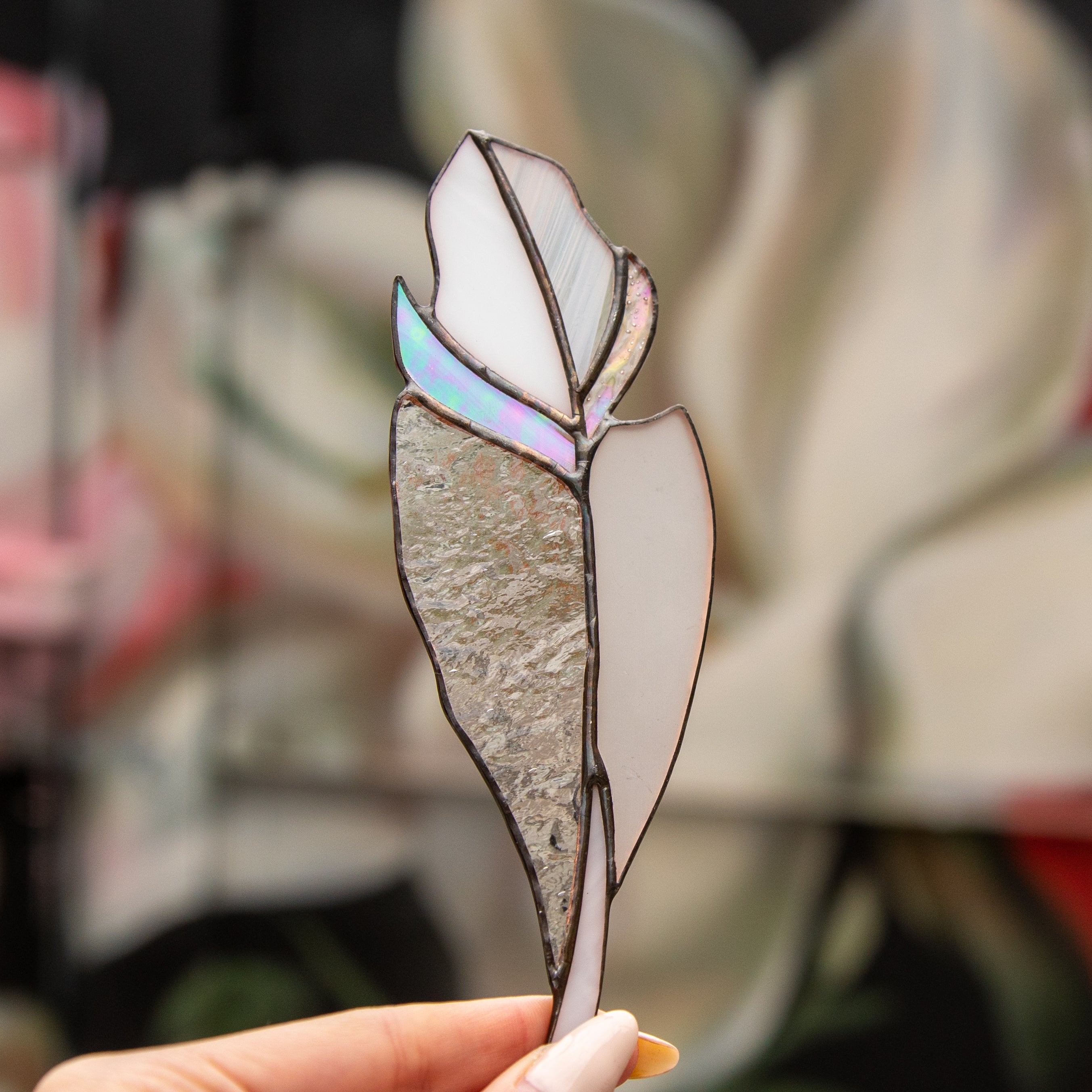 Clear  stained glass feather suncatcher with shades of orange