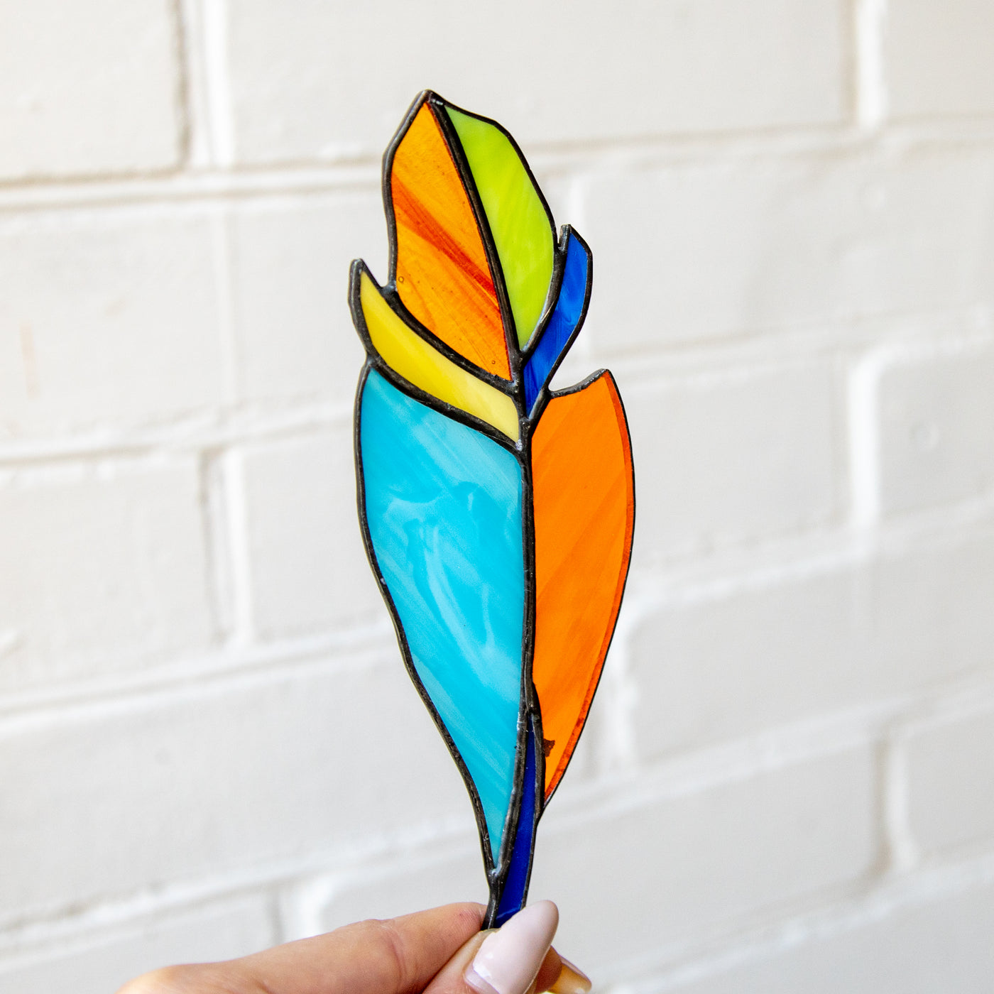 Colourful stained glass feather suncatcher 