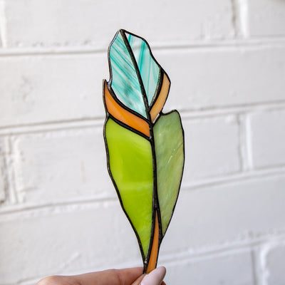 Green feather suncatcher of stained glass for window