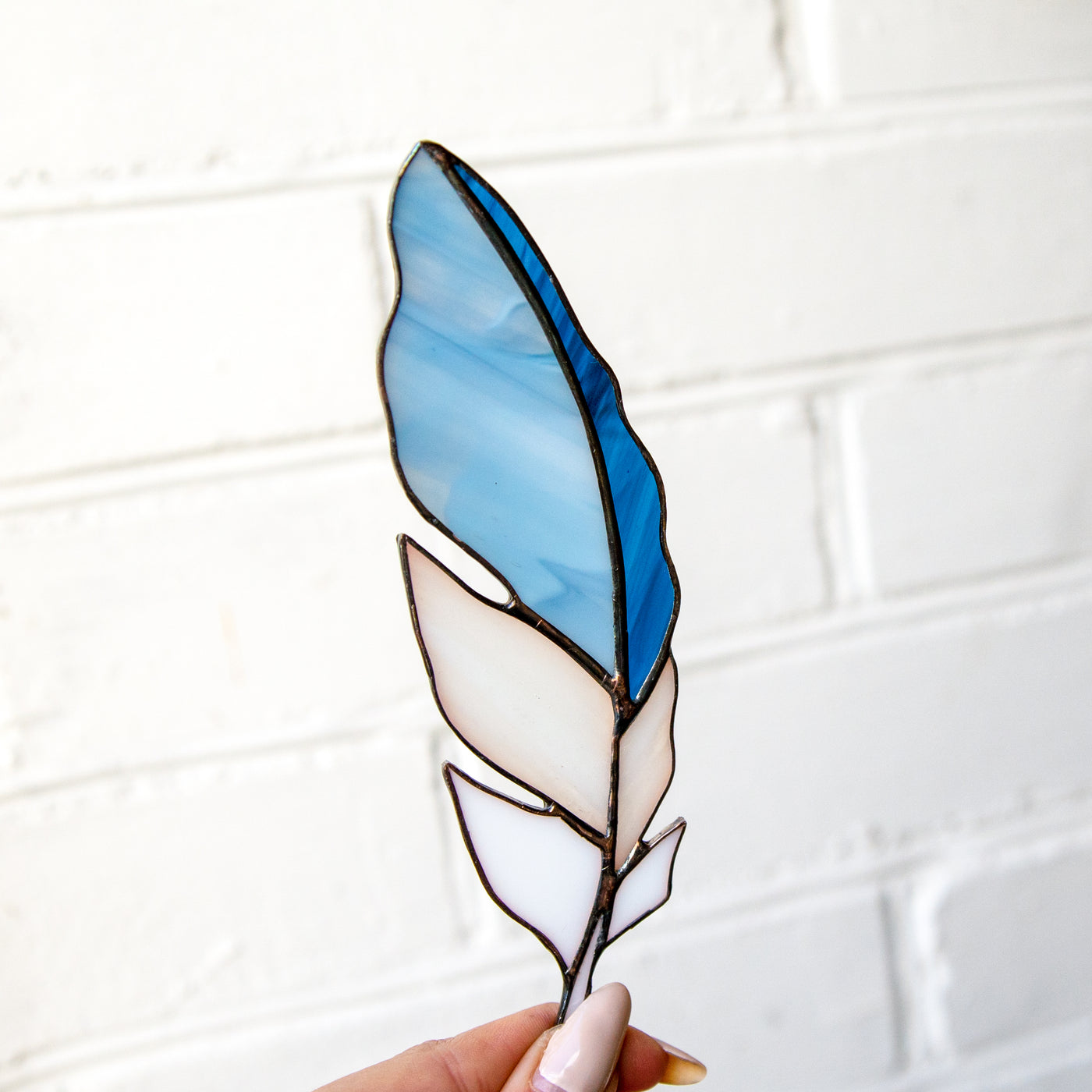 Sky-blue feather suncatcher for window 