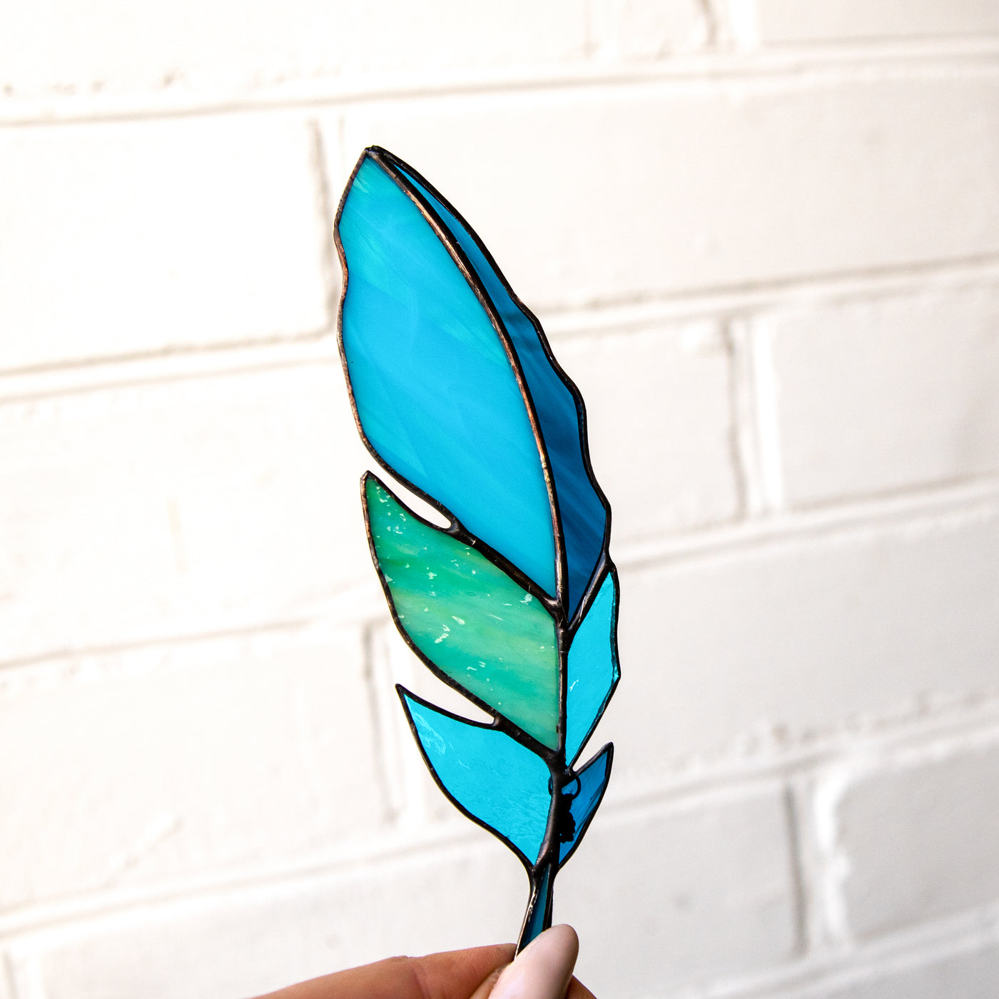 Bright stained glass aquamarine feather suncatcher for window decoration