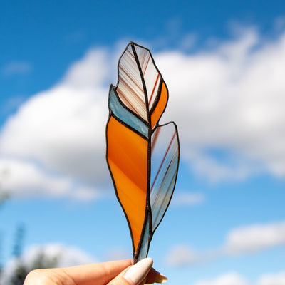 Orange feather suncatcher of stained glass